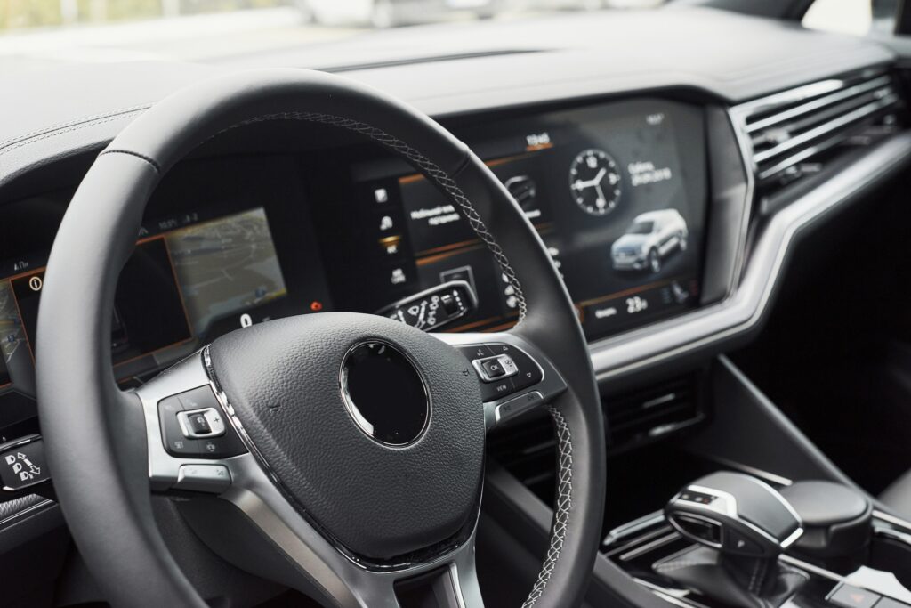 Interior of a prestigious modern black car. Leather comfortable seats and accessories and steering